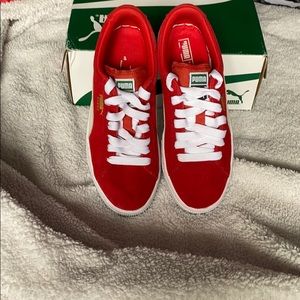 Red suede pumas